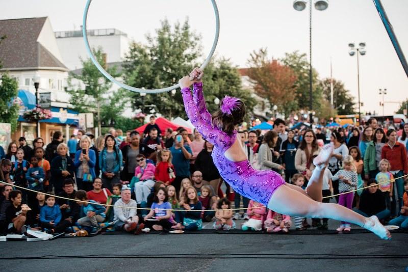 A gymist performs in downtown Amherst