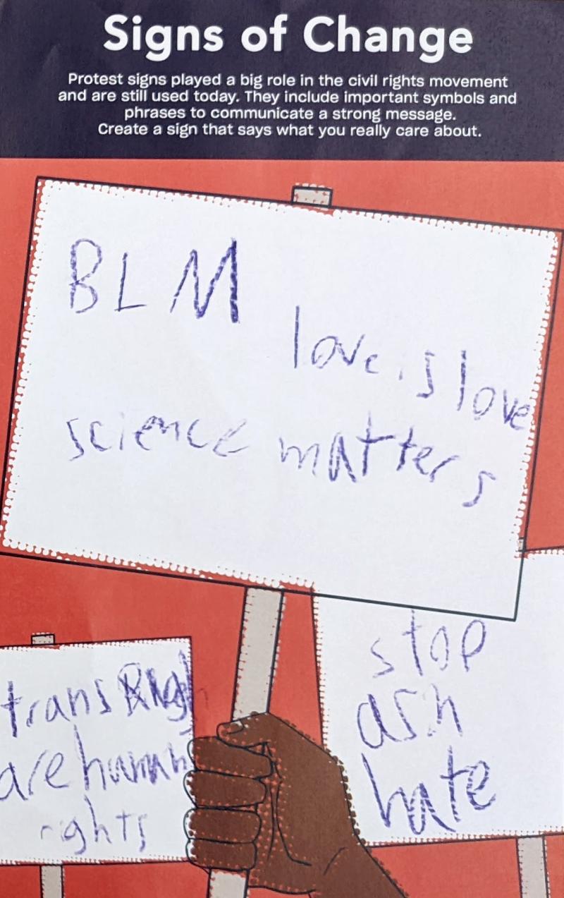 Image of handout with child's own messages written on protest signs.
