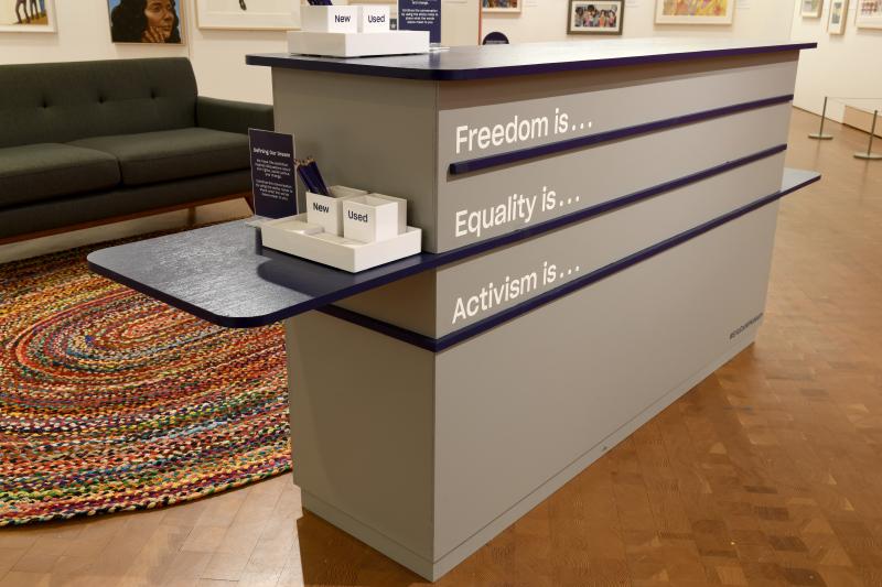 Interactive station with invitation to provide definitions of freedom, equality, and activism.