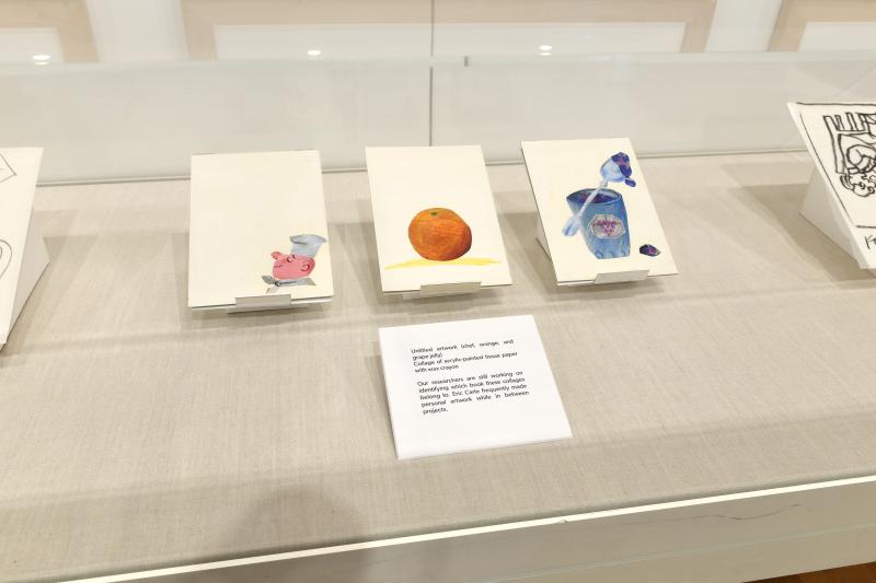 Photograph of gallery showing framed art and graphics.