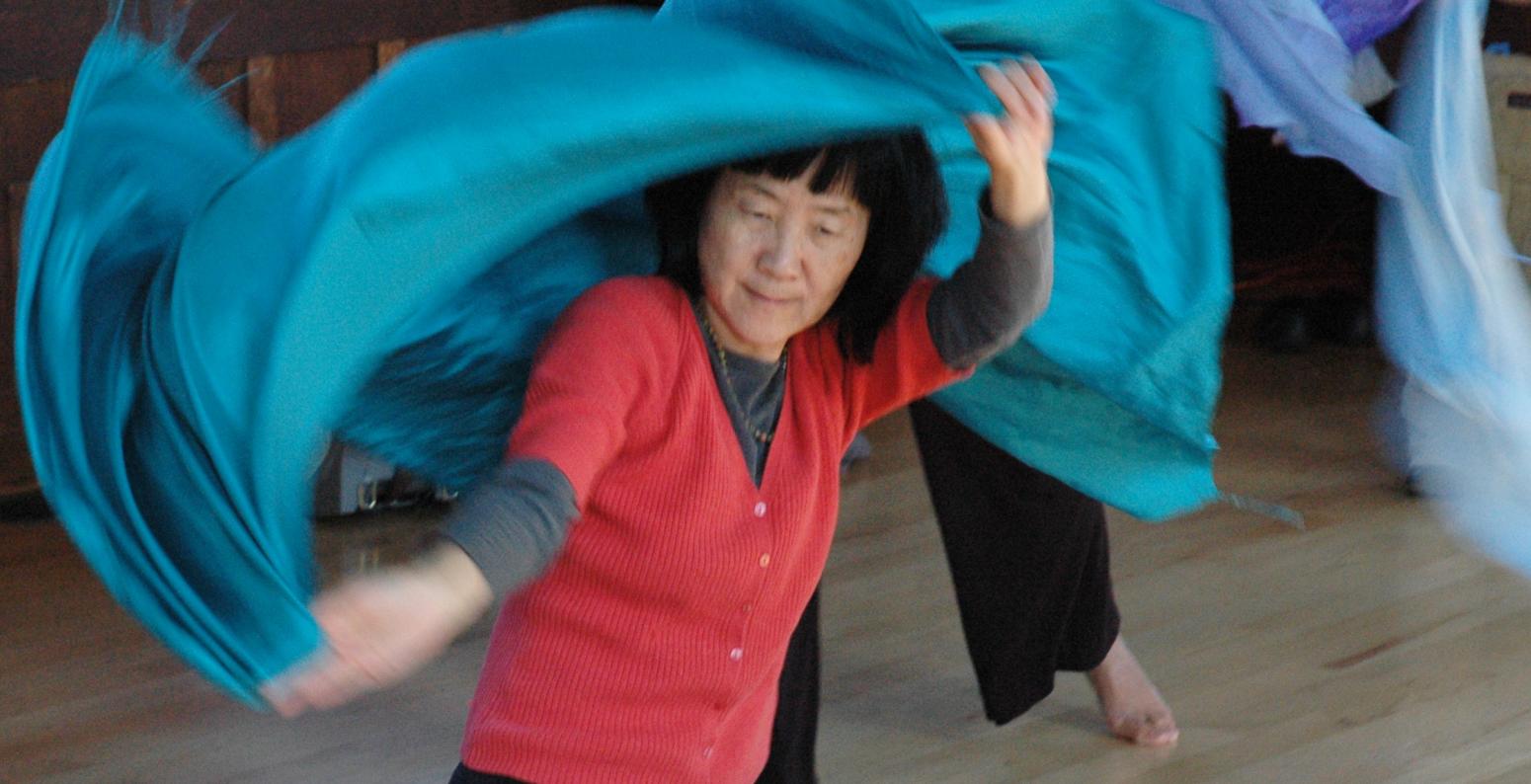 Woman dancing with fabric