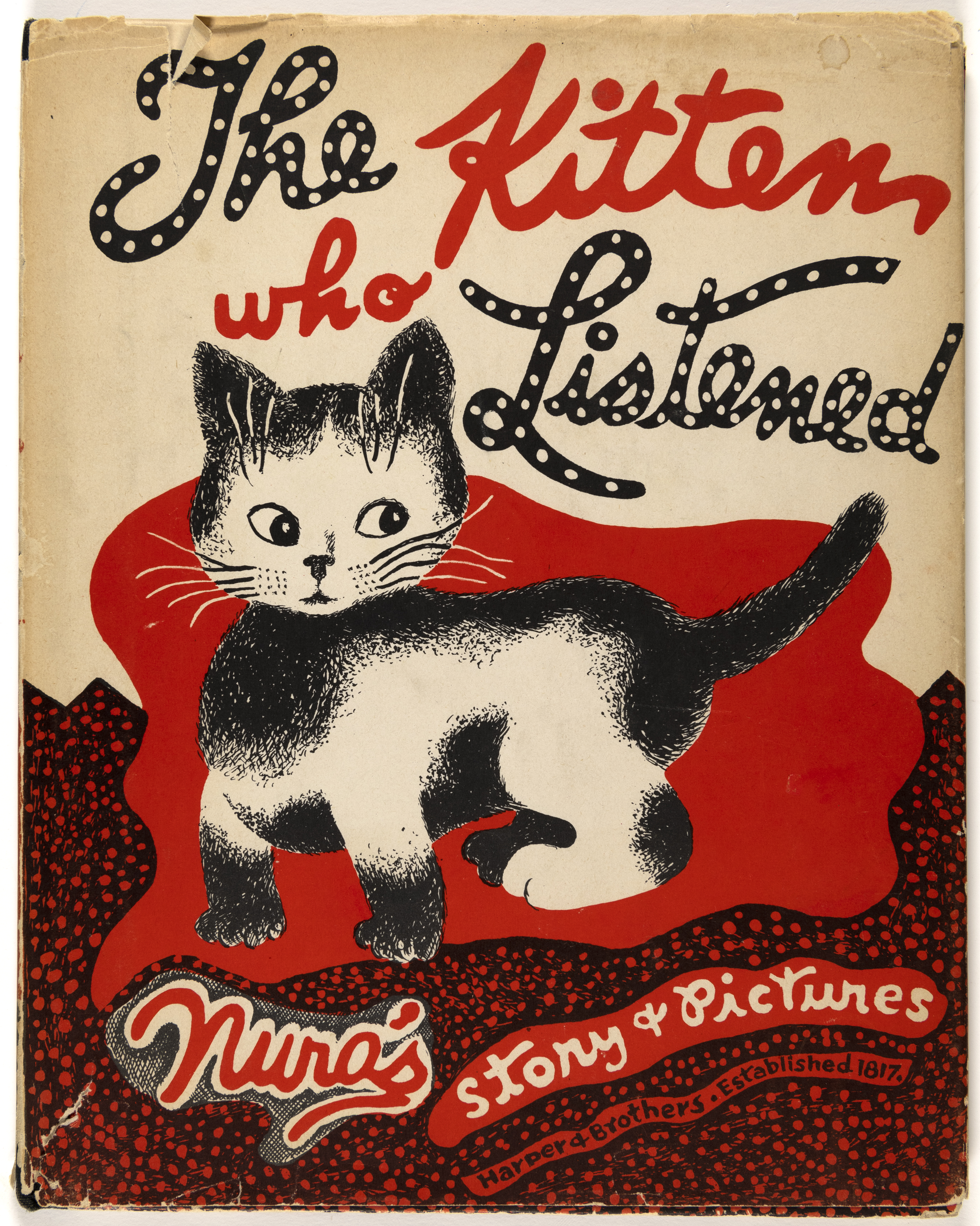 Book cover showing kitten with abstract shapes. 