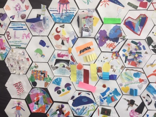 Hexagon collages tessellated together to make a mural