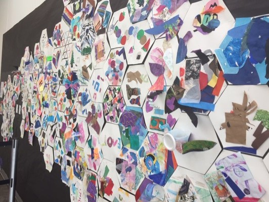 A closer view of the hexagon collages on the wall.