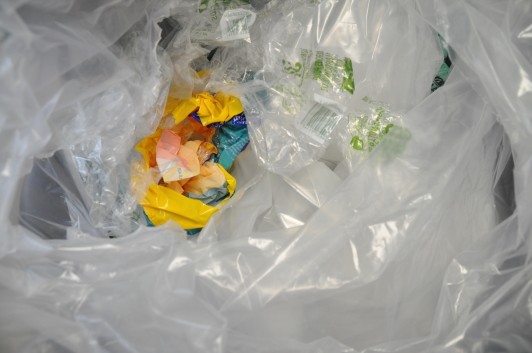 A bag filled with plastic wrappers and bags.