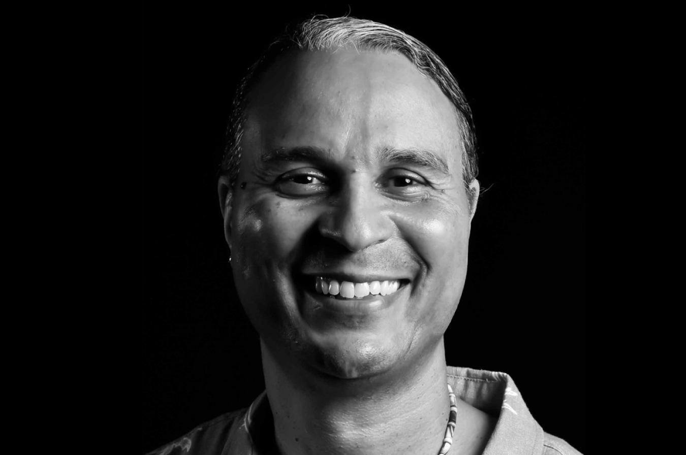 black and white photo of man smiling