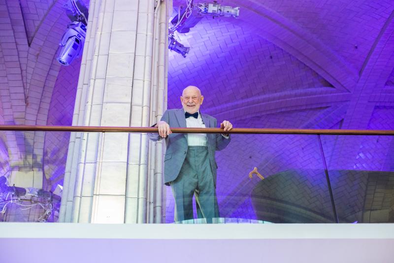 Eric Carle smiles as he looks down from the second floor of Guastavino's
