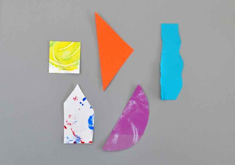 A variety of collage papers cut into geometric shapes