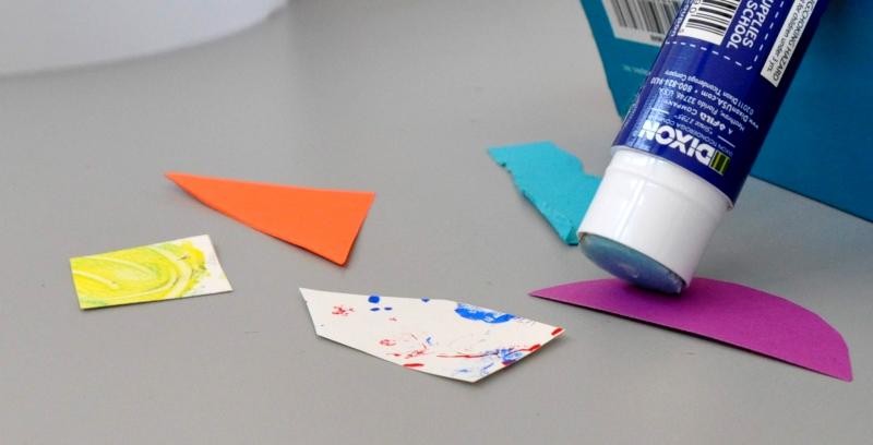 Glue being applied to collage papers