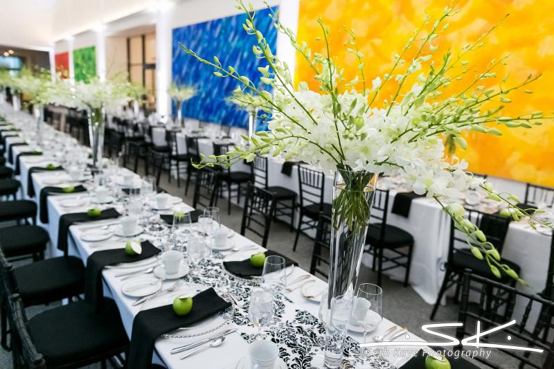Two long banquet tables set up for a wedding.