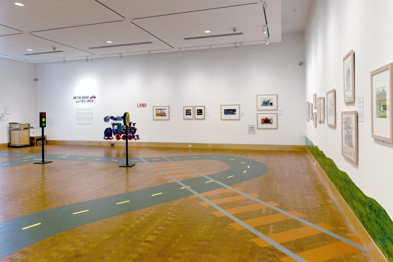 Installation image showing walls with framed art.