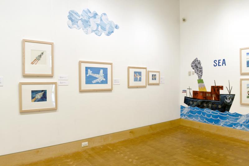 Installation image showing walls with framed art.