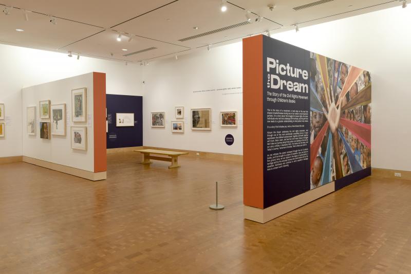 Installation image showing walls with framed art.