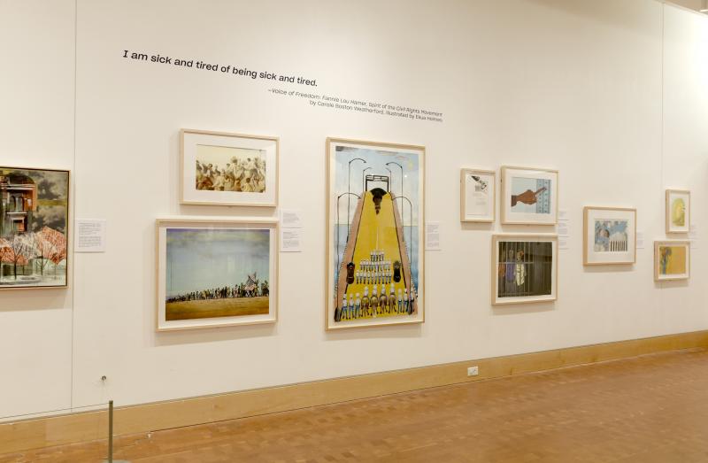 Installation image showing walls with framed art.