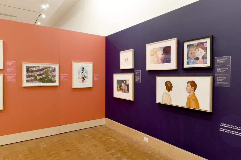 Installation image showing walls with framed art.