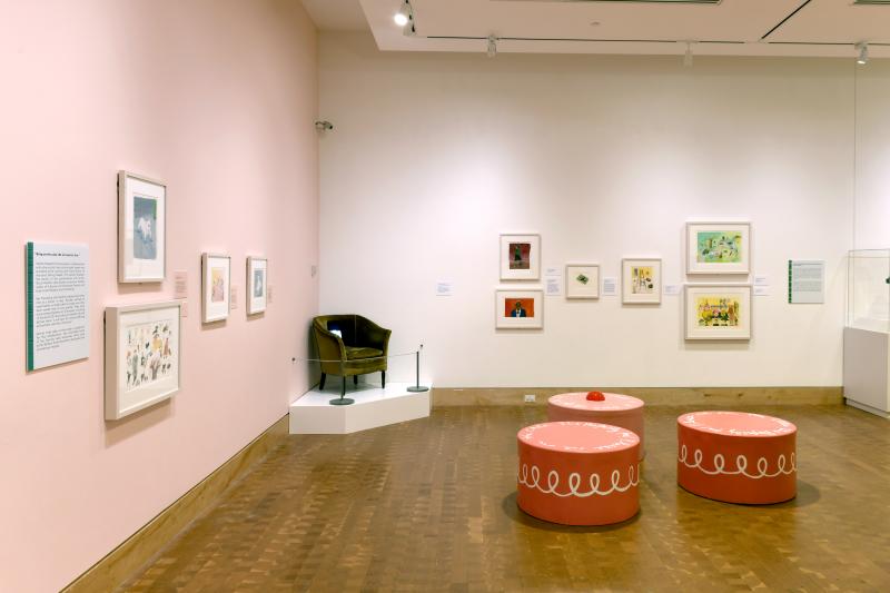 Installation image showing walls with framed art.