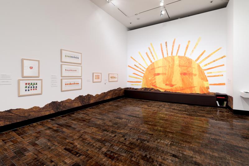 Installation image showing walls with framed art.
