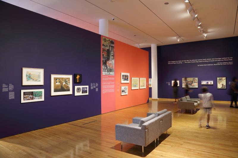 Installation image showing walls with framed art.