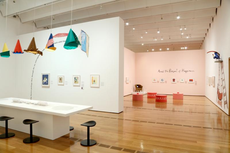 Installation image showing walls with framed art.