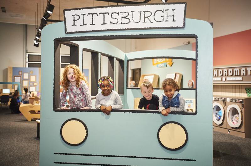 installation image showing kids in Pigeon bus.