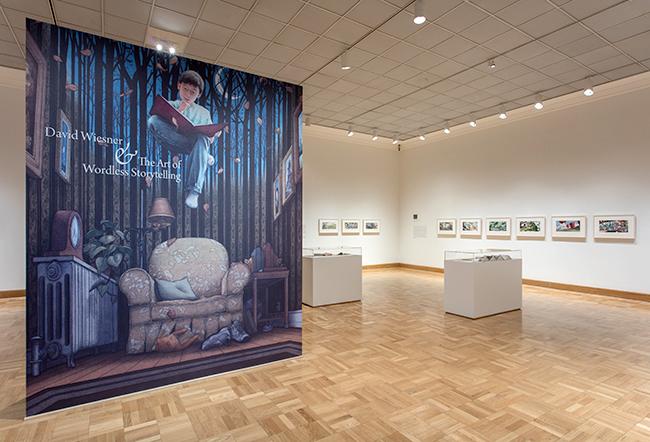 Installation image showing walls with framed art.