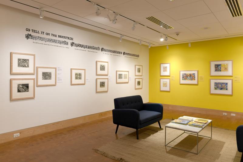 Installation image showing walls with framed art.