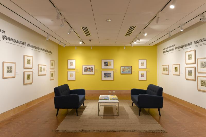 Installation image showing walls with framed art.