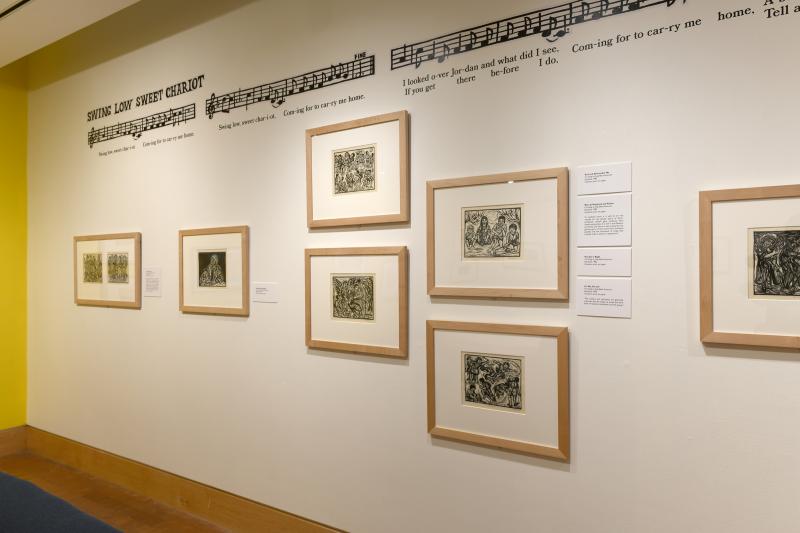 Installation image showing walls with framed art.