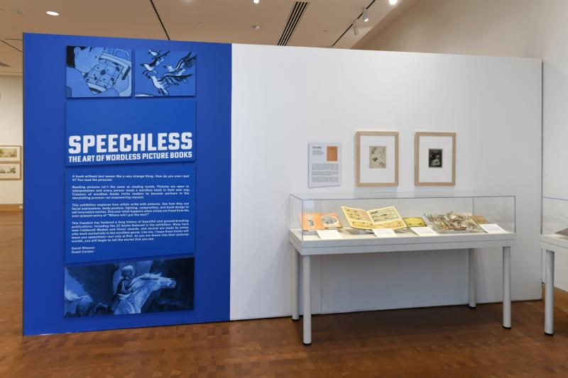 Installation image showing walls with framed art.