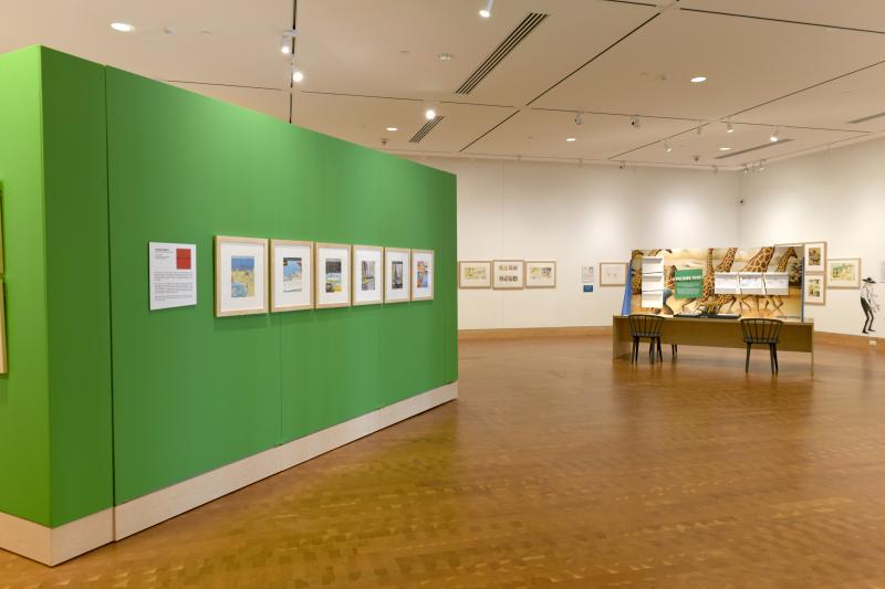 Installation image showing walls with framed art.