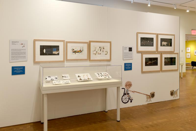Installation image showing walls with framed art.