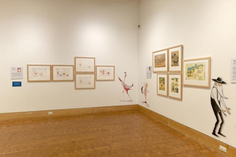 Installation image showing walls with framed art.