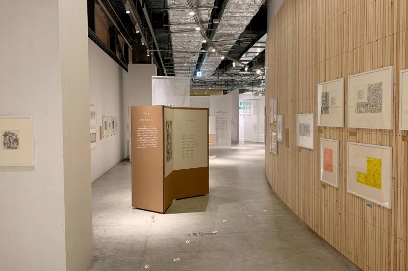Installation image showing walls with framed art.