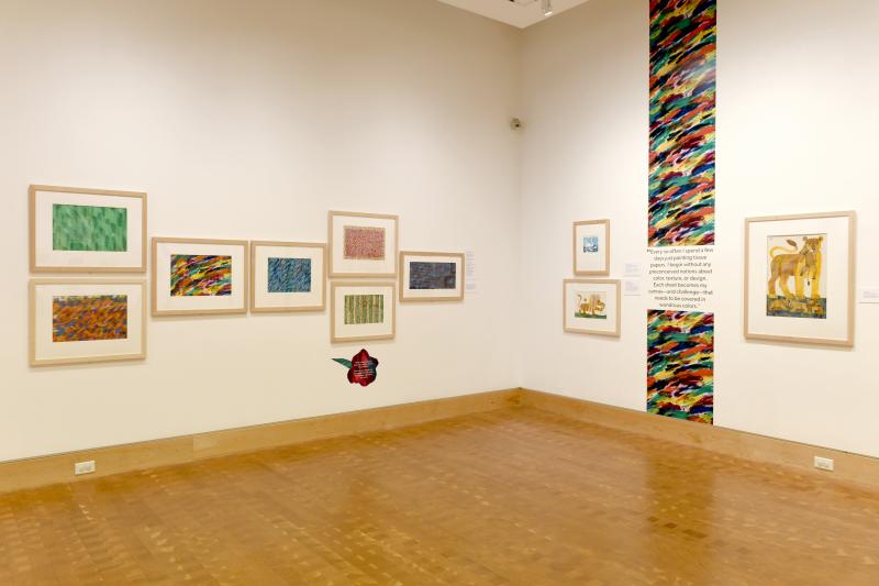Installation image showing walls with framed art.