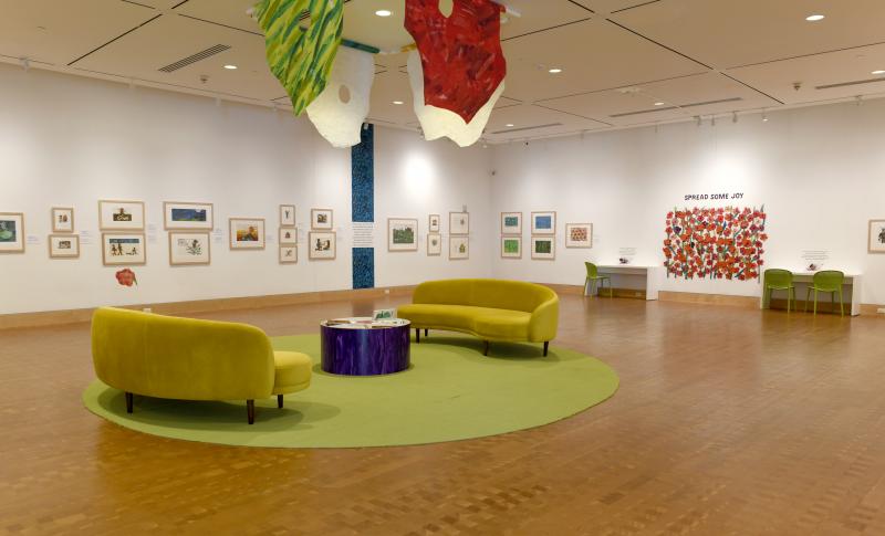 Installation image showing walls with framed art.