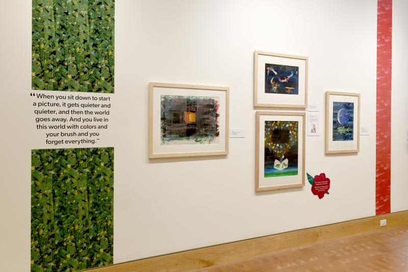 Installation image showing walls with framed art.