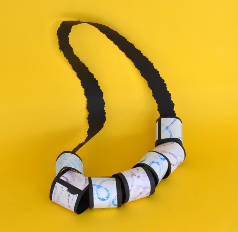 Paper necklace with rolled paper beads