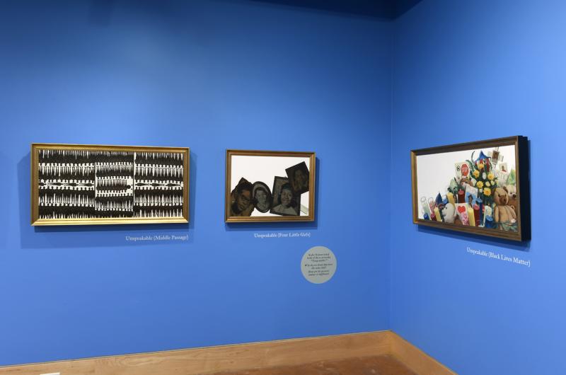 Photograph of paintings hanging on wall in gallery