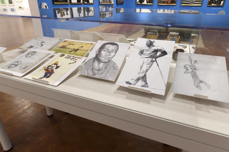 Photograph of childhood drawings including self-portrait, Mickey Mouse, Spock, and Michael Jordan.
