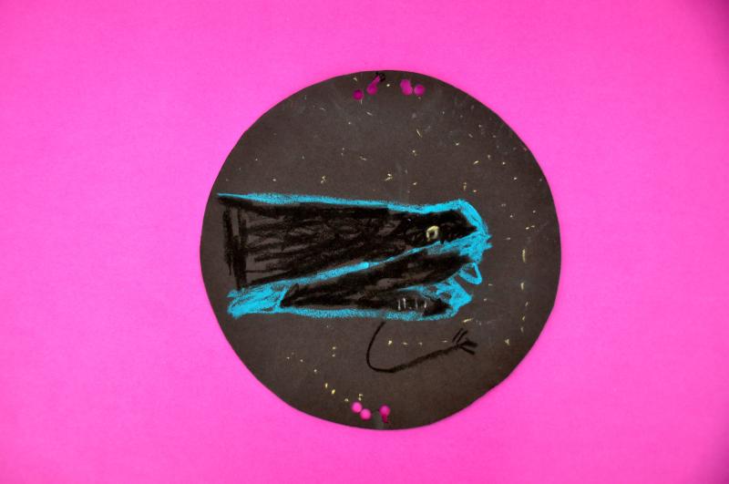 An oil pastel of a deep-sea creature with a bright blue outline.