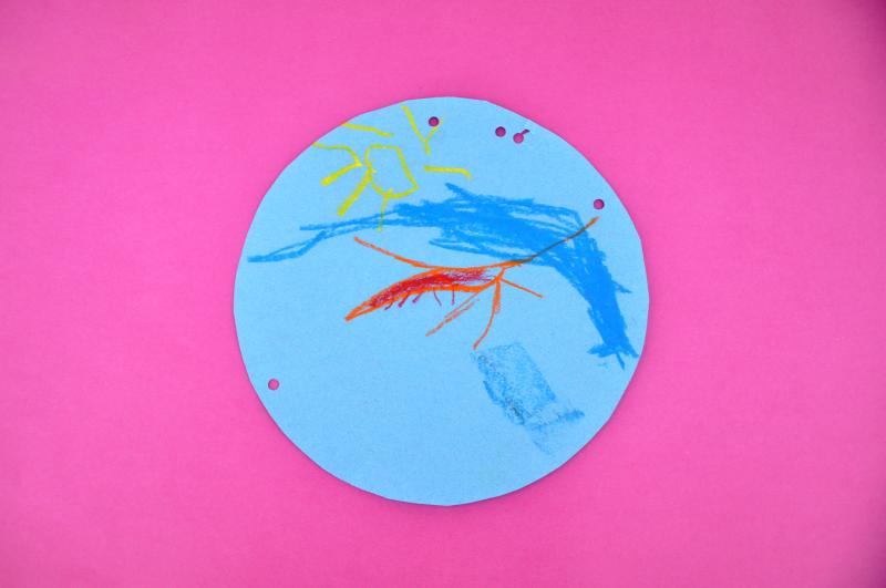 Artwork made with oil pastels showing an ocean scene.