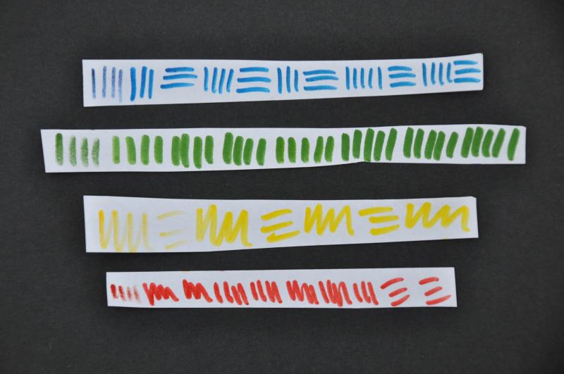 Four papers showing a progression of the markers being revived.