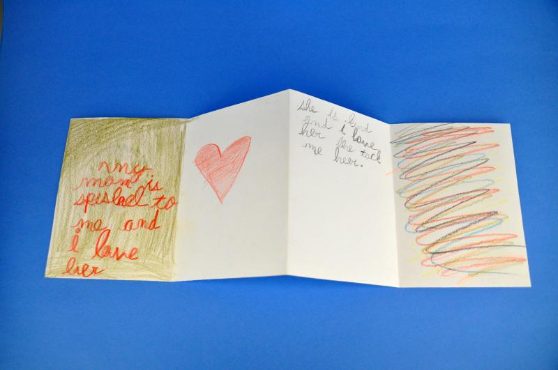 An accordion fold book with words describing how special someone's mother is to them and a picture of a heart.