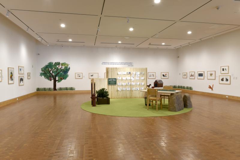 Installation image showing art framed on walls.