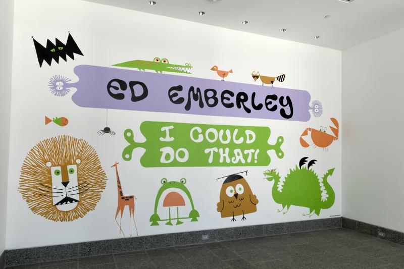 Installation image showing walls with framed art.