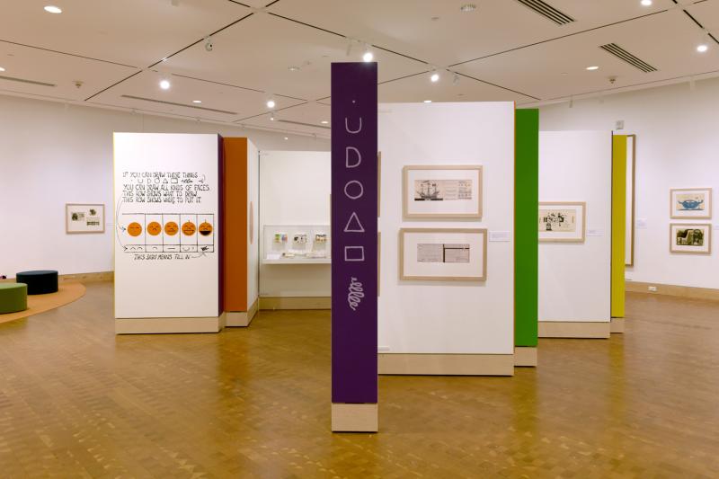 Installation image showing walls with framed art.