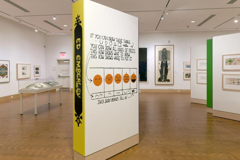 Installation image showing walls with framed art.