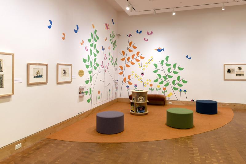 Installation image showing walls with framed art.