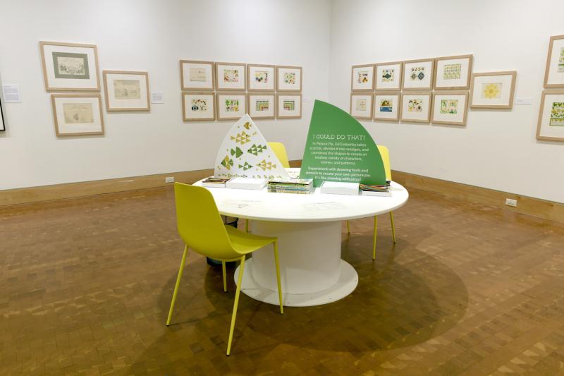 Installation image showing walls with framed art.