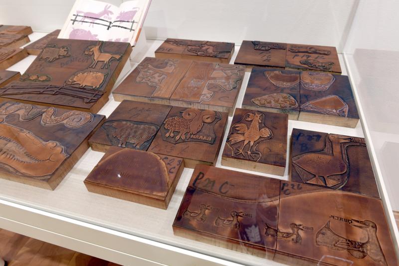 Installation image showing walls with framed art.